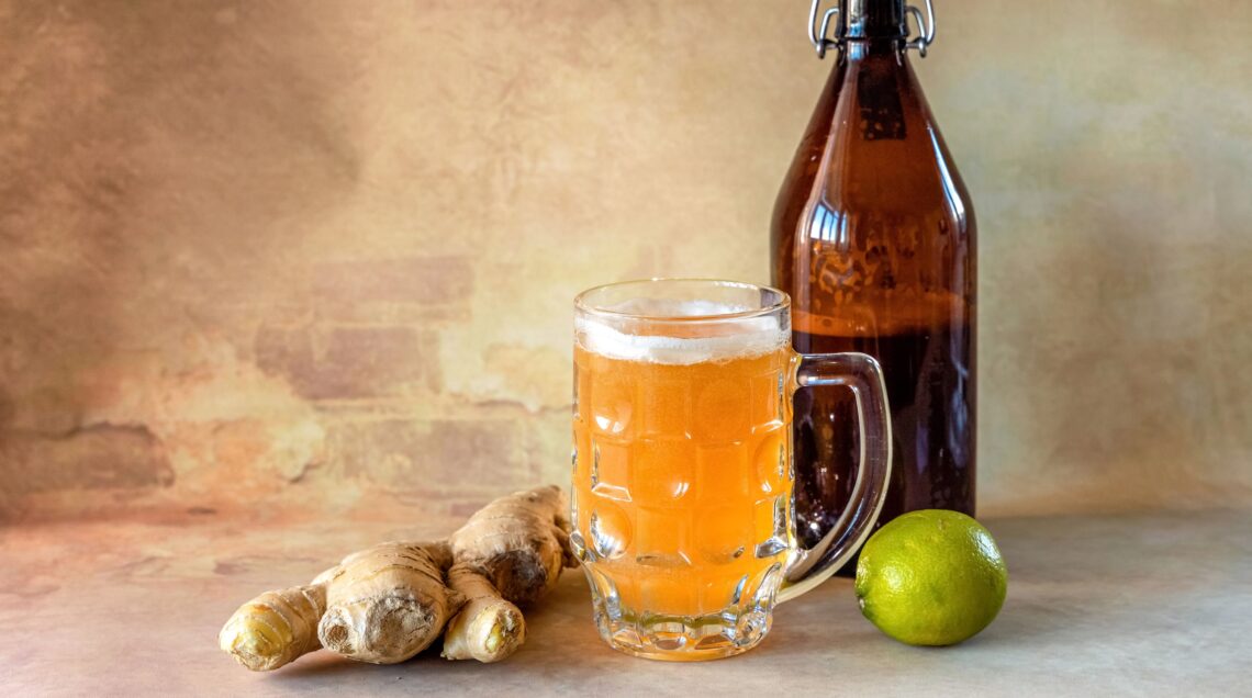 Organic Ginger Ale Soda in a Glass with Lemon and Lime.