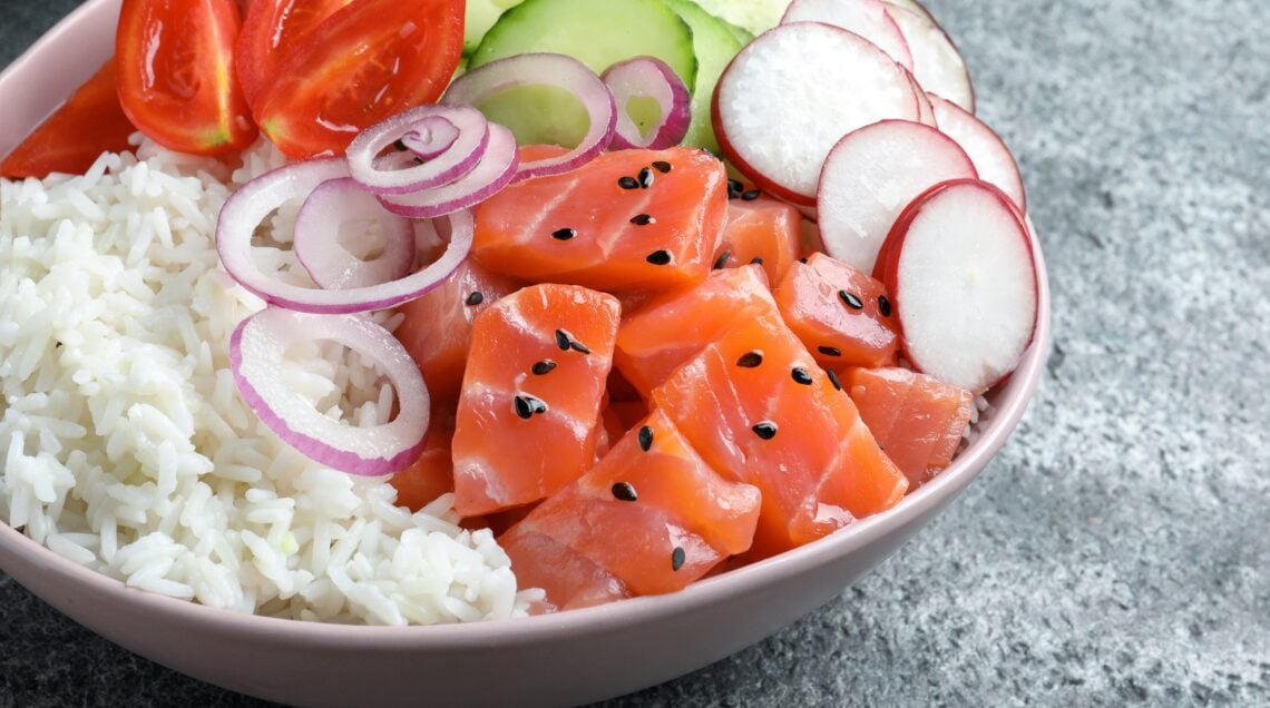 Delicious poke bowl with salmon and vegetables